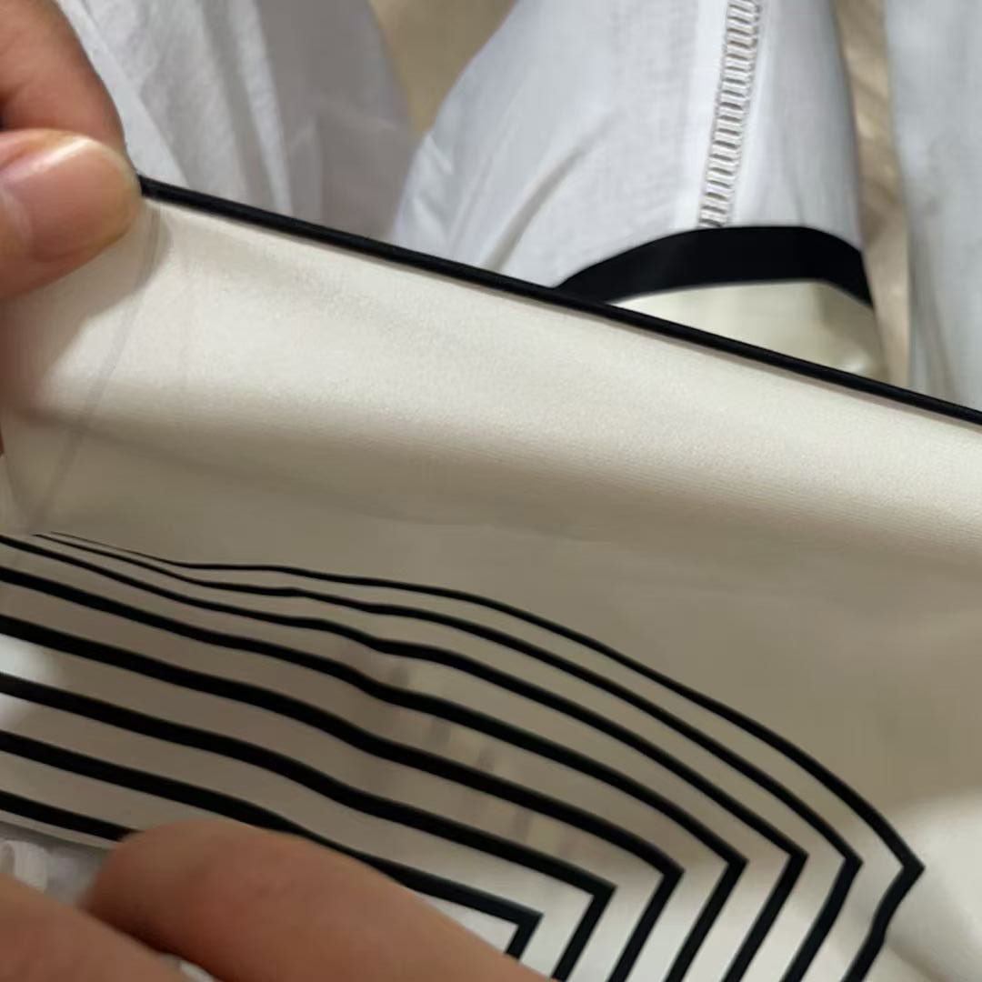 Hand-rolled hemming a silk scarf